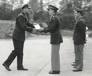 Keith E. Harris (center) receiving a medal in 1943